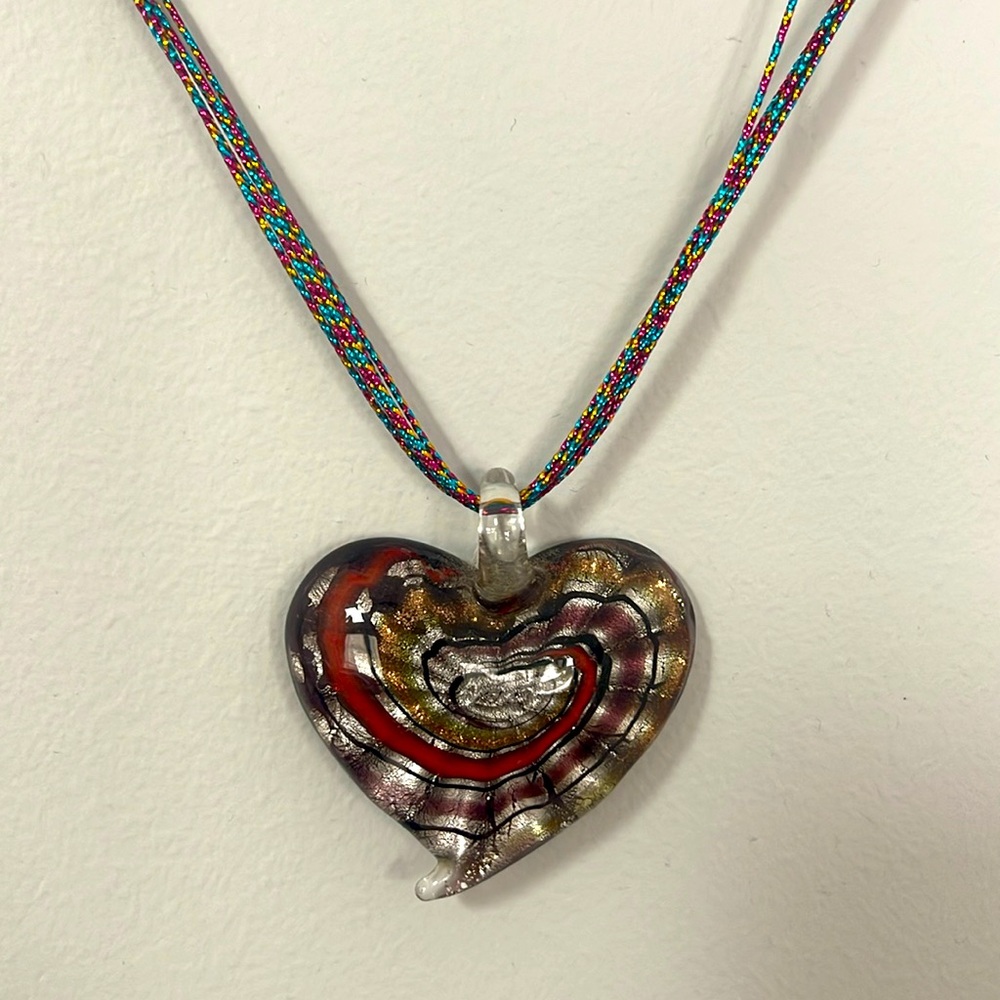 Handmade glass heart necklace. Beautiful colors swirled into the heart.